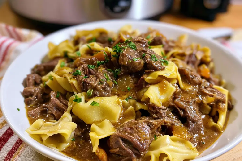 Crockpot Mississippi beef and noodles with tender shredded beef