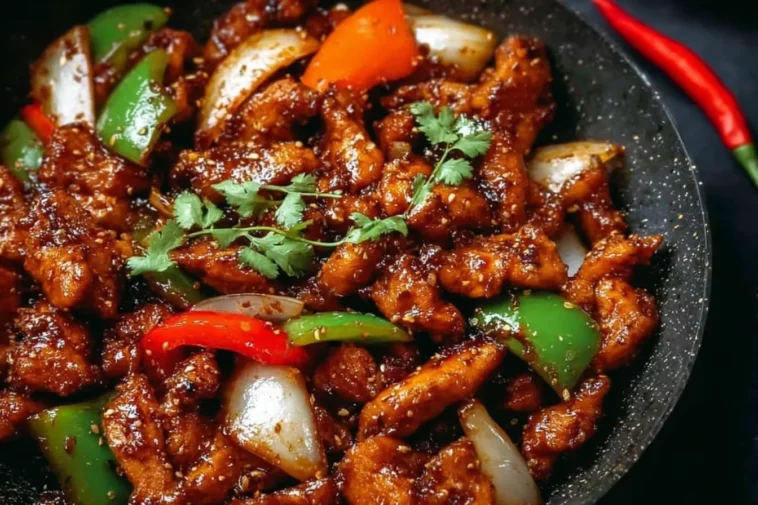 Black Pepper Chicken Plated with Fresh Herbs