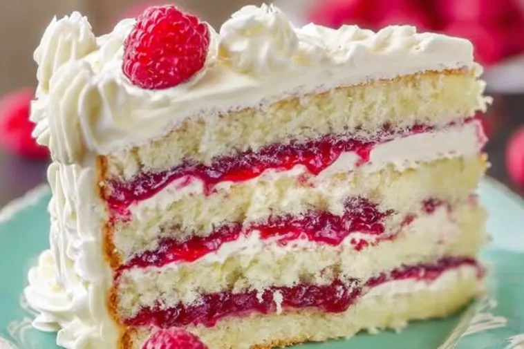 Delicious White Chocolate Raspberry Layer Cake Slice