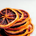 Colorful Dried Orange Slices on a Wooden Board