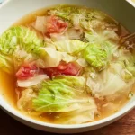 Healing Cabbage Soup in a Bowl Featuring Fresh Ingredients