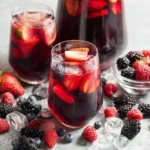 Iced Tea Berry Sangria in a Pitcher with Fresh Berries