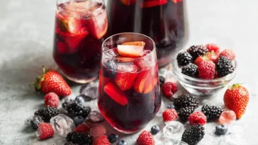 Iced Tea Berry Sangria in a Pitcher with Fresh Berries