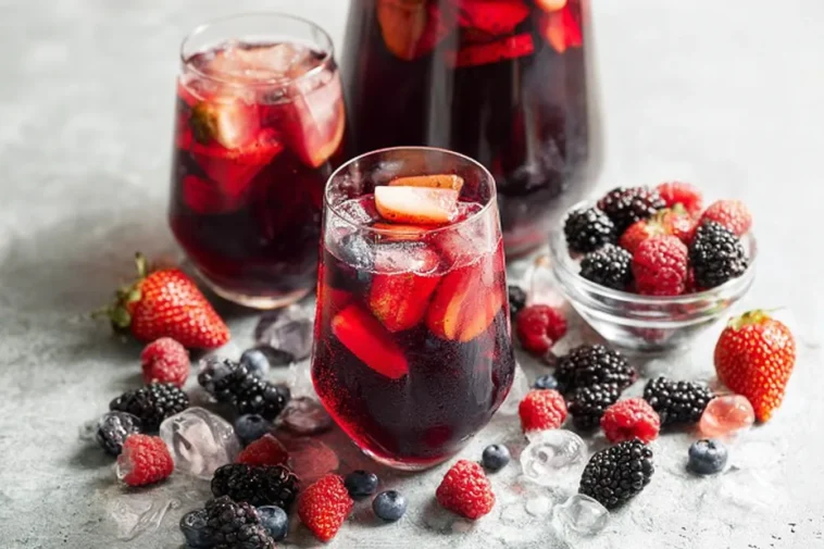 Iced Tea Berry Sangria in a Pitcher with Fresh Berries