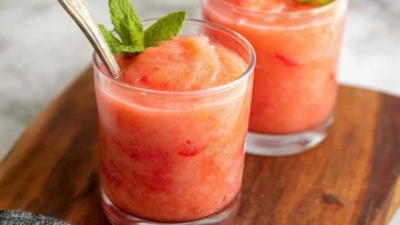 Strawberry Lemonade Slushie in a Glass with Fresh Berries