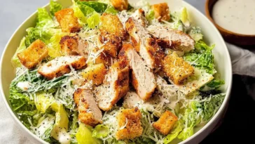 Chicken Caesar Salad Garnished with Croutons