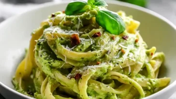 Creamy 15 Minute Avocado Pasta Garnished with Basil