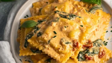 Creamy Tuscan Ravioli on a White Plate