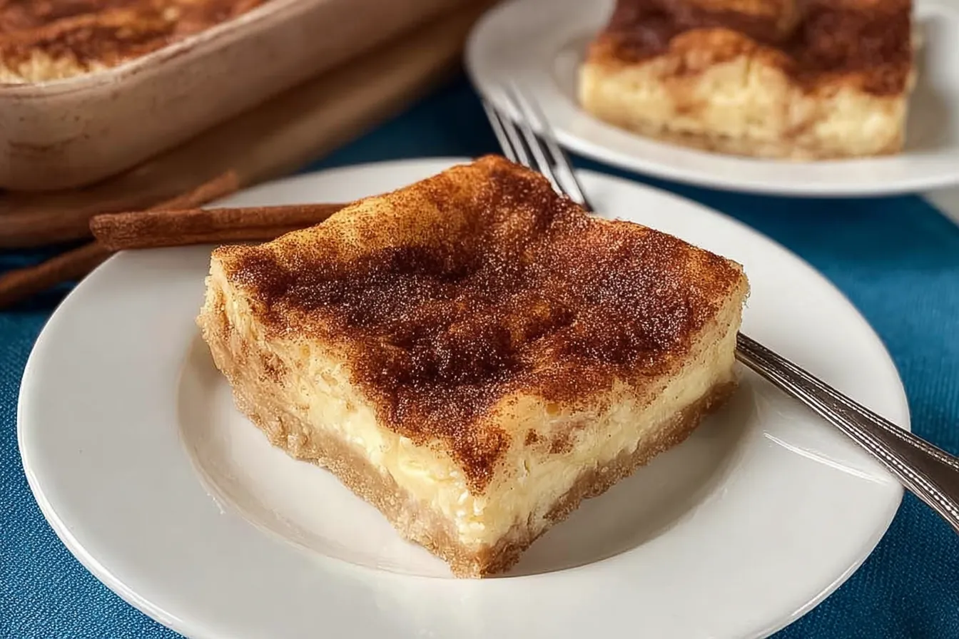 Easy Churro Cheesecake Bars: Irresistibly Delicious Dessert 3 Easy Churro Cheesecake Bars on a Plate