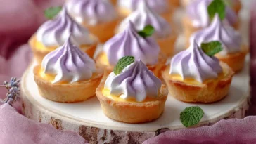 Mini Lemon Tart with Lilac Meringue on Elegant Serving Plate