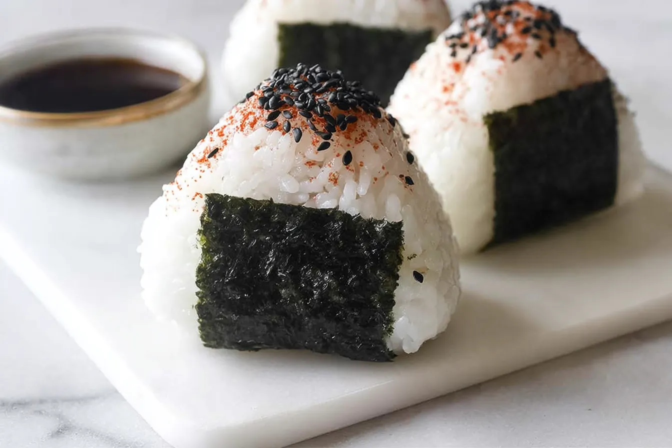 Spicy Tuna Onigiri: Unleash Bold Flavors You’ll Love! 3 Spicy Tuna Onigiri on a Plate