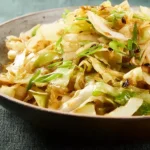 Super Easy Cabbage Stir Fry on a Colorful Plate