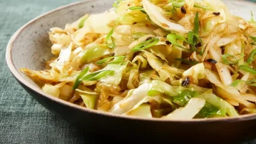 Super Easy Cabbage Stir Fry on a Colorful Plate