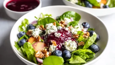 Tasty Easter Spring Salad with Goat Cheese on a Bright Table