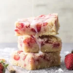 Strawberry Lemon Blondies: A Sweet Summer Delight 5 Delicious Strawberry Lemon Blondies on a White Plate