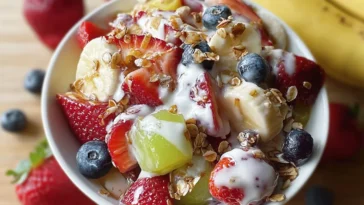 Delicious Breakfast Fruit Salad with Honey Yogurt Dressing in a Bowl