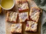 Delicious Lemon Rhubarb Bars on a White Plate