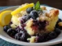 Lemon Blueberry Cheesecake Dump Cake Plated Delight