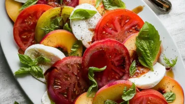 Peach and Tomato Caprese Salad on a Rustic Table