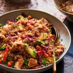 Vibrant Quinoa Salad with Peanut Dressing on a Plate