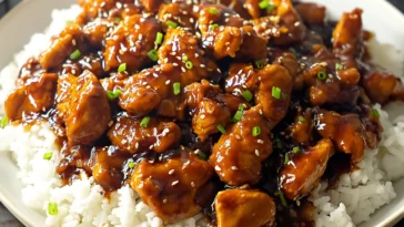 Easy Bourbon Chicken Plated with Fresh Garnish