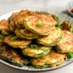 Korean Zucchini Fritters: Deliciously Crispy & Easy! 5 Crispy Korean Zucchini Fritters on a Plate