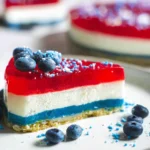 No-Bake Red White & Blue Jello Cheesecake Delight 15 No-Bake Red White & Blue Jello Cheesecake on a Plate