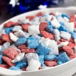 Patriotic Muddy Buddies: Celebrate with This Fun Treat! 5 Patriotic Muddy Buddies in a Bowl