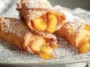 Delicious Peach Cobbler Egg Rolls on a Plate