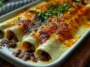 Comforting Cheesy Beef Enchiladas with Creamy White Sauce Plated