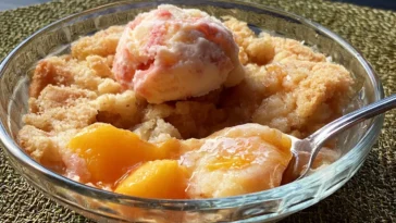 Crisp Peach Cobbler Plated with Fresh Peaches