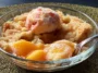 Crisp Peach Cobbler Plated with Fresh Peaches