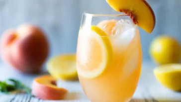 Ginger Peach Lemonade in a Glass with Fresh Fruits