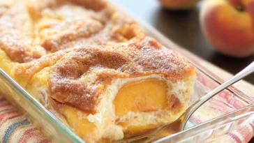 Delicious Peaches and Cream Pie Slice on a Plate