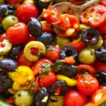 Fresh Cherry Tomato Salad with Olives: A Flavorful Delight 14 Fresh Cherry Tomato Salad with Olives in a Bowl