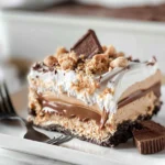 Peanut Butter Lasagna: A Deliciously Decadent Dessert 5 Peanut Butter Lasagna Slice on a White Plate