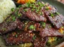 Tender Beef Bulgogi on a Plate with Sesame and Scallions