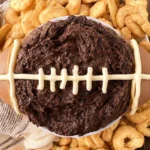 Brownie Batter Football Dip in a Bowl with Dipping Snacks