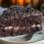 Delicious Decadent Black Velvet Halloween Cake with Spiderweb Frosting